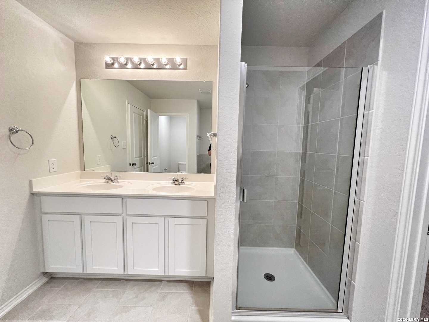 29529 Spring Copper Bulverde, TX 78163 - Photo 38 of 41 a bathroom with a shower a sink and a mirror