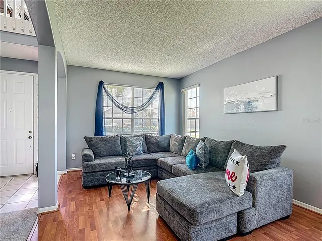 a living room with furniture and a window