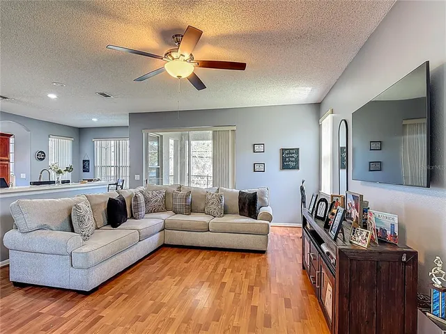 a view of a dining room with furniture wooden floor and a chandelier