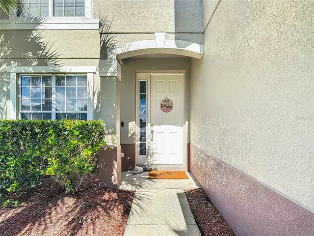 a kitchen with a sink a stove and cabinets