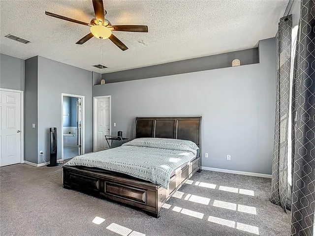 an aerial view of residential houses with outdoor space and lake view