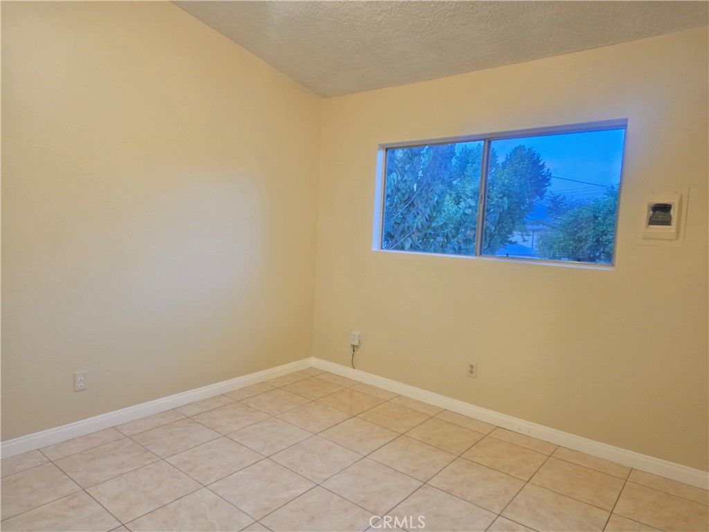 2642 Maxson Road, Unit 6 El Monte, CA 91732 - Photo 11 of 13 an empty room with wooden floor and cabinet