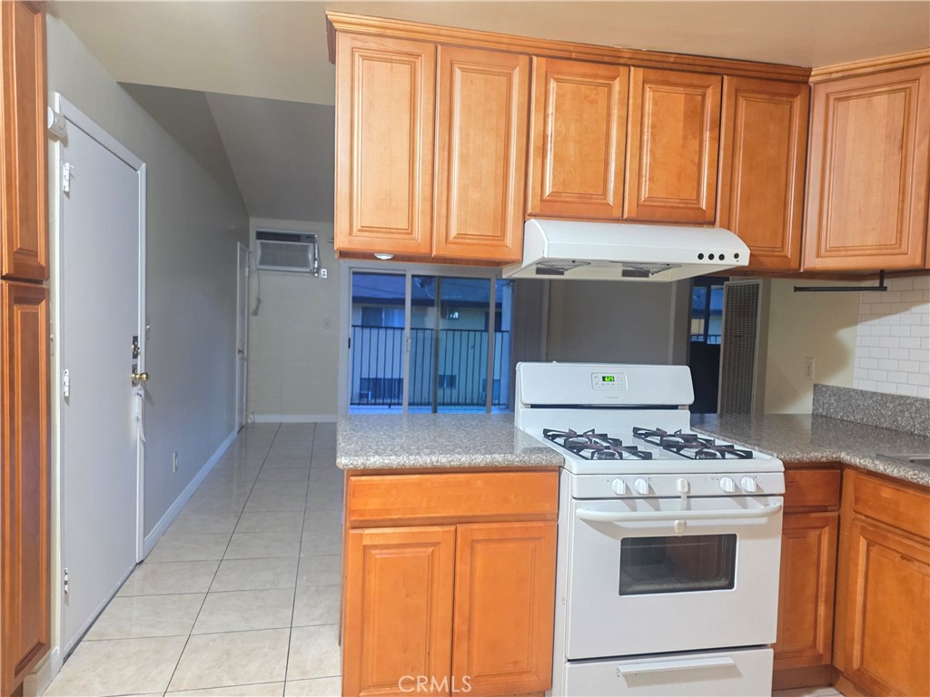2642 Maxson Road, Unit 6 El Monte, CA 91732 - Photo 5 of 13 a kitchen with stainless steel appliances granite countertop a stove a refrigerator and a stove