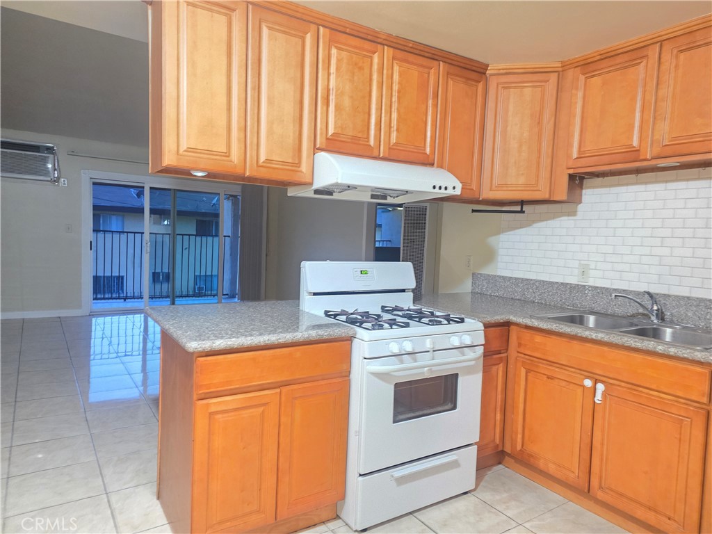 2642 Maxson Road, Unit 6 El Monte, CA 91732 - Photo 6 of 13 a kitchen with a stove and a sink