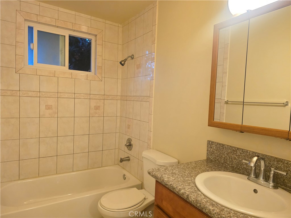 2642 Maxson Road, Unit 6 El Monte, CA 91732 - Photo 9 of 13 a bathroom with a granite countertop sink toilet and shower