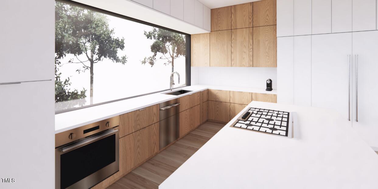 4120 Picardy Drive Raleigh, NC 27612 - Photo 6 of 21 a kitchen with stainless steel appliances a sink and a window