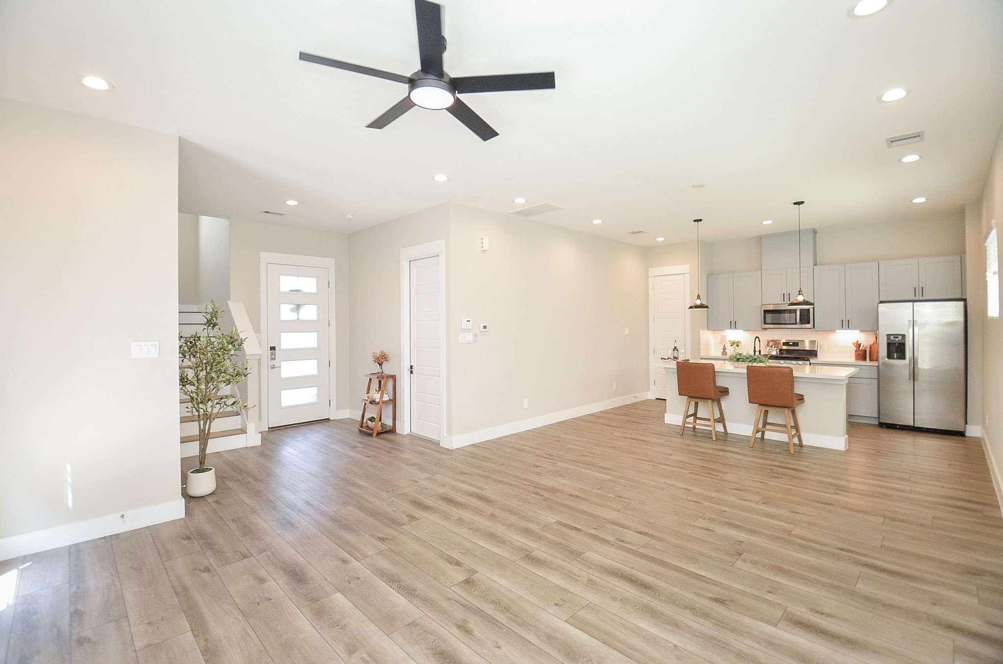1223 West Tidwell Road Houston, TX 77091 - Photo 10 of 30 Effortless living and entertaining in this bright, open-concept space that blends the kitchen and living area into a spacious layout.