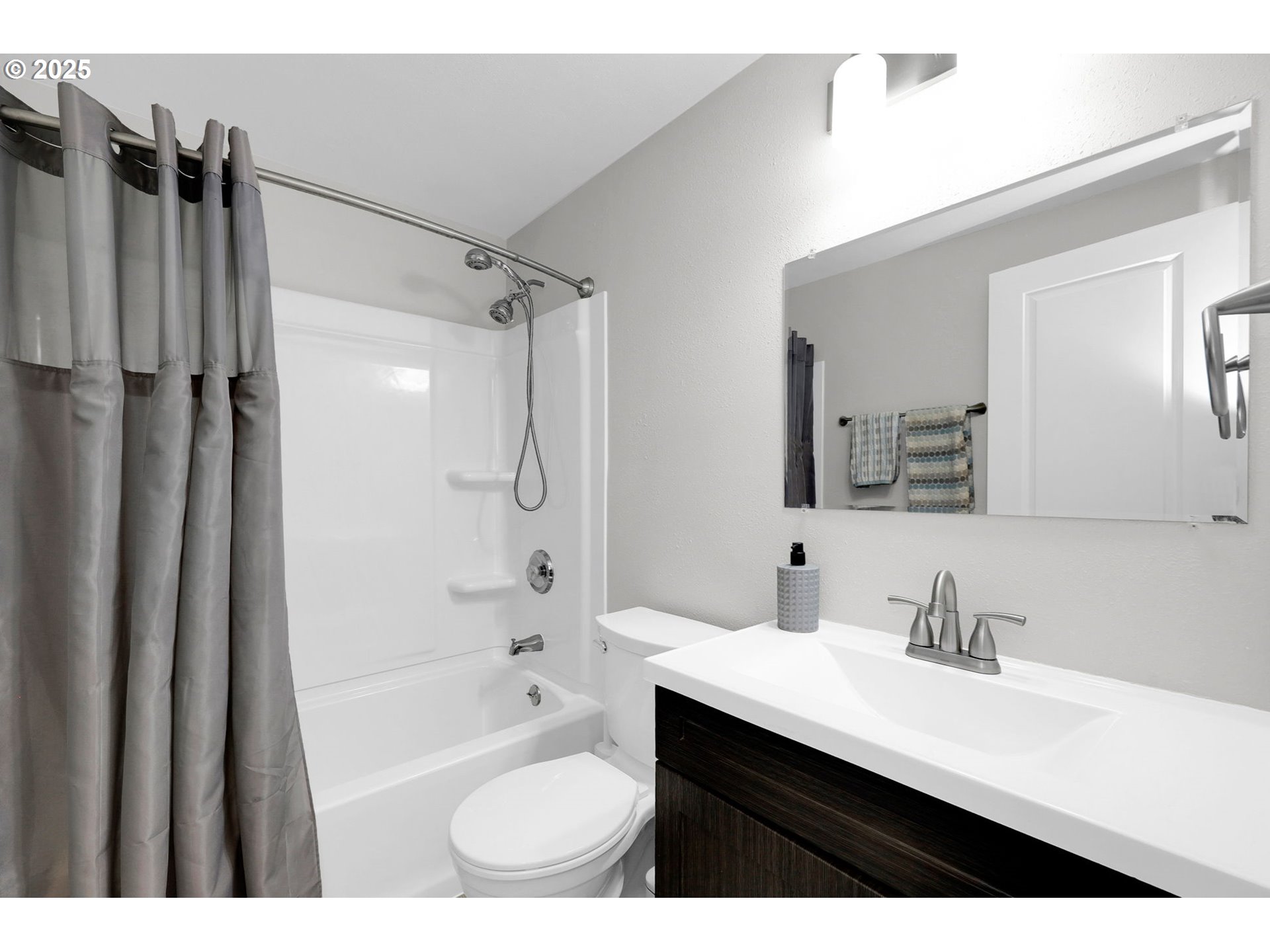 728 21st Street Springfield, OR 97477 - Photo 8 of 21 a bathroom with a sink double vanity granite tub shower and a mirror