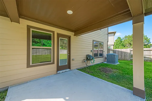 a view of a house with backyard and porch