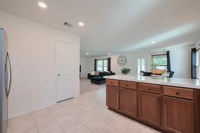 a spacious en suite bathroom with a double vanity sink and a mirror
