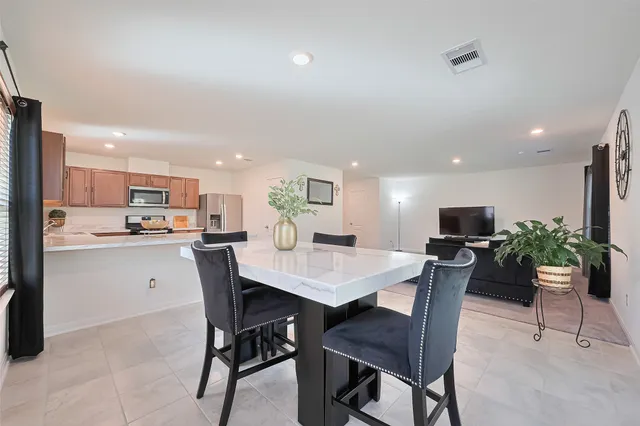 a view of a dining room with furniture