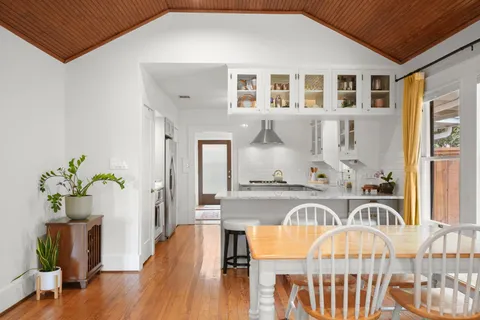 a very nice looking dining room with a table and chairs