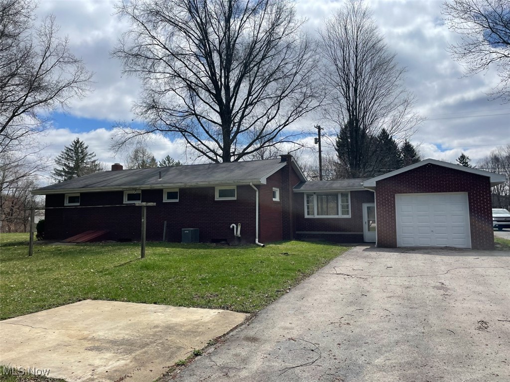 855 Georgetown Road Salem, OH 44460 - Photo 21 of 28 Single story home with driveway, a front lawn, a garage, and a chimney