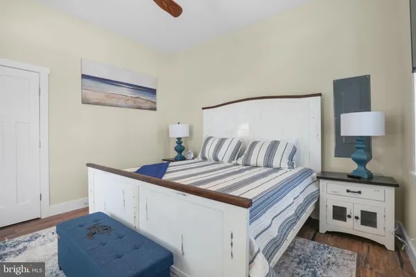 a bedroom with a bed and a dresser