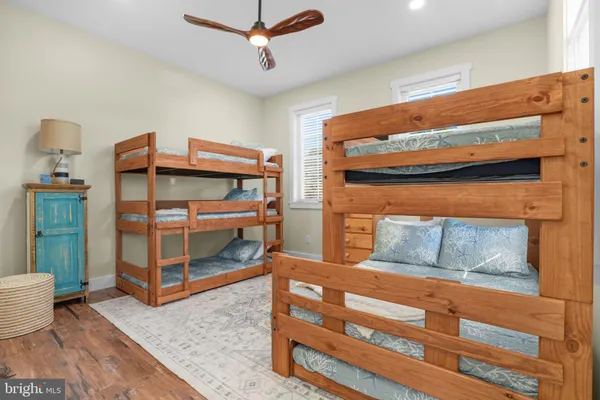 a bedroom with furniture and a dresser