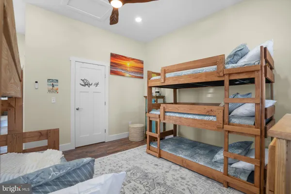 a bedroom with furniture and a dresser