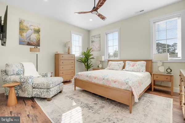 a spacious bedroom with a bed and window