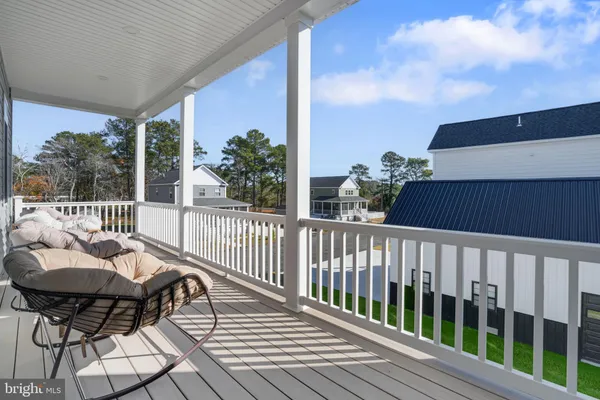 a balcony with couches and a coffee table