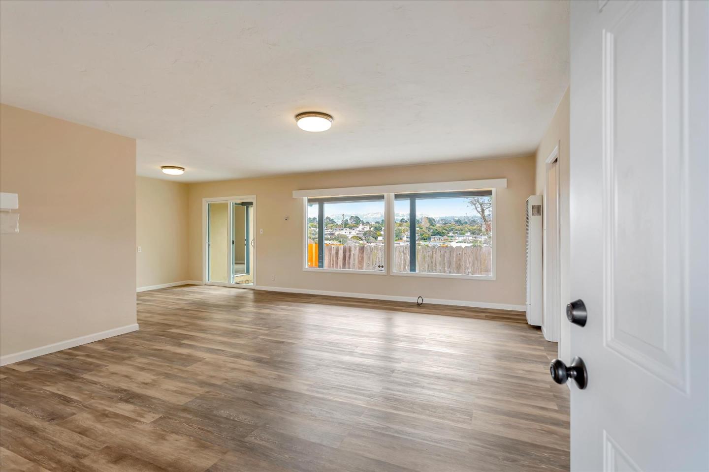 950 Portola Drive Del Rey Oaks, CA 93940 - Photo 3 of 37 an empty room with wooden floor and windows