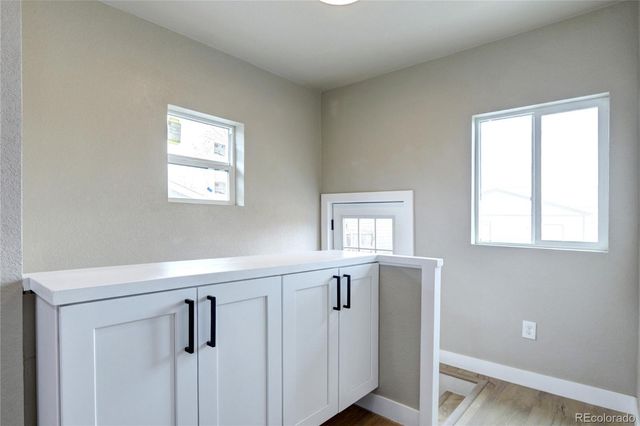 a view of a hallway with windows