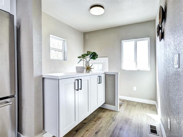 a view of entryway with wooden floor