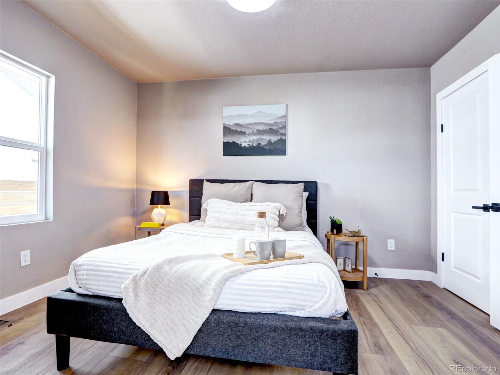 2525 South Lincoln Street Denver, CO 80210 - Photo 24 of 38 a bedroom with bed and wooden floor