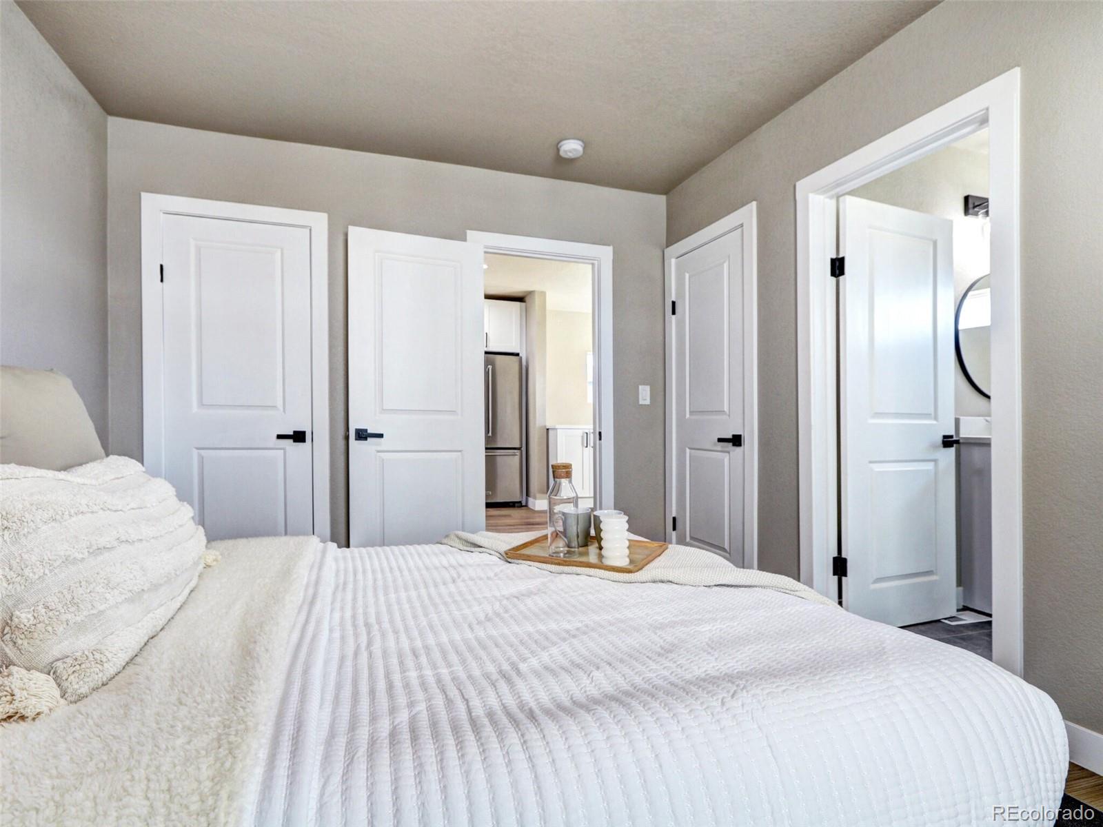 2525 South Lincoln Street Denver, CO 80210 - Photo 26 of 38 a bedroom with a bed and a mirror
