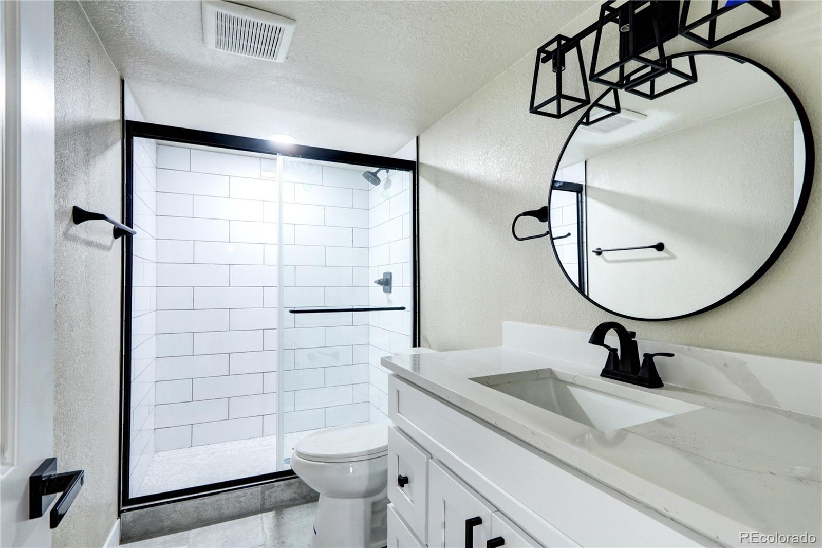 2525 South Lincoln Street Denver, CO 80210 - Photo 27 of 38 a bathroom with a sink a toilet and shower
