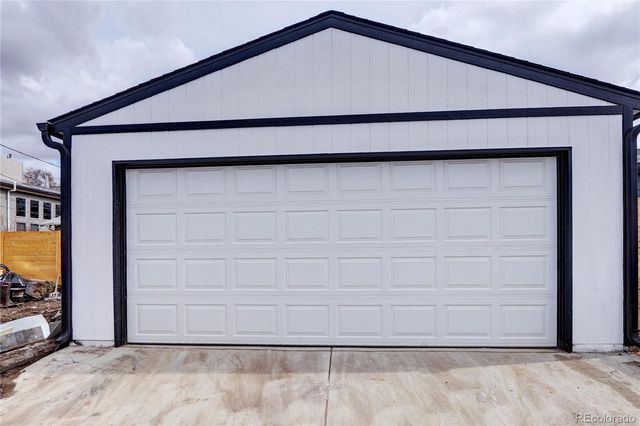 a picture of a bench in front of a wall