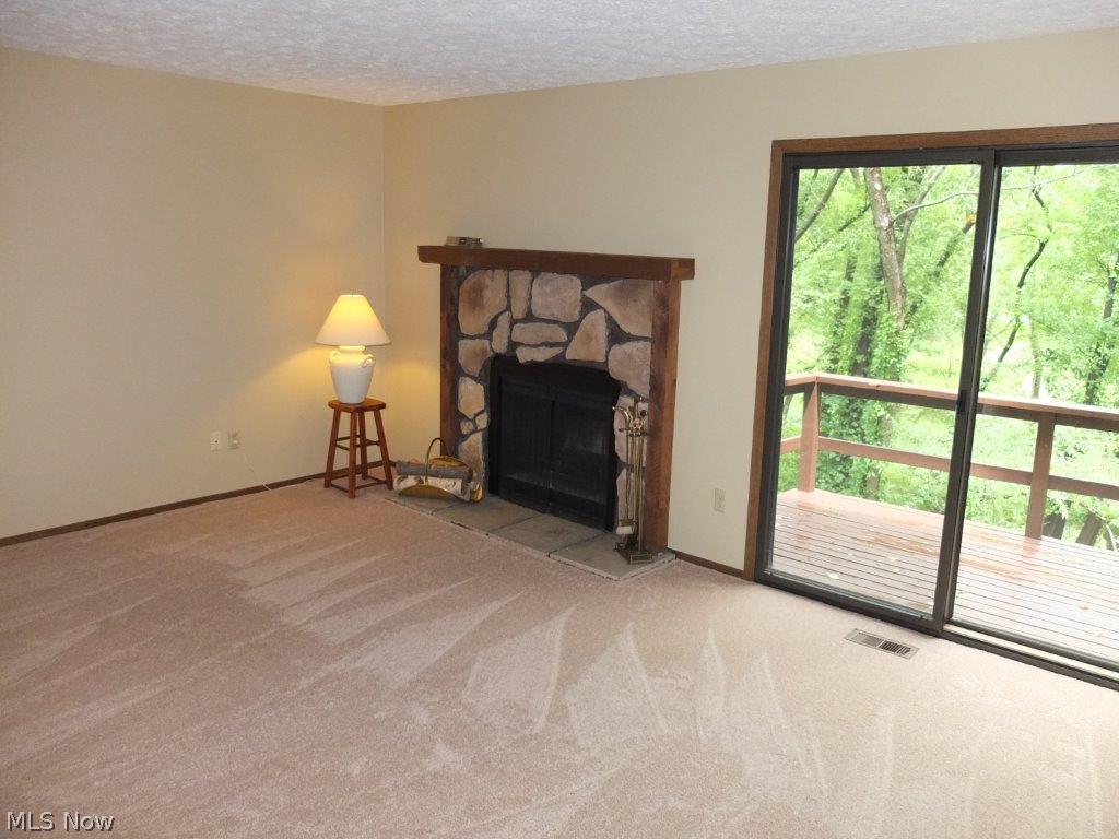 239 Perry Drive Northwest Canton, OH 44708 - Photo 2 of 18 Great room with fireplace.