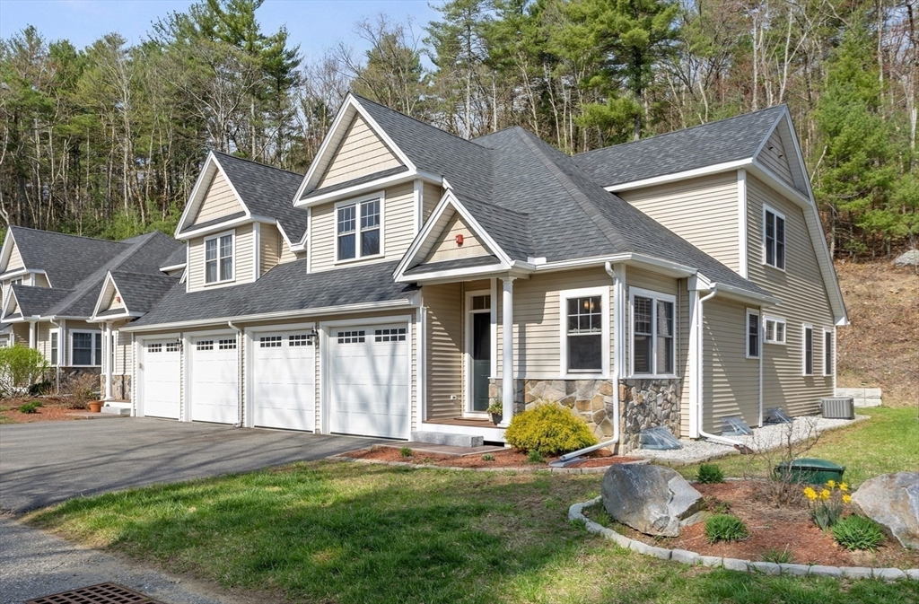 12 Trail Ridge Way, Unit A Harvard, MA 01451 - Photo 1 of 31 front view of a house with a yard