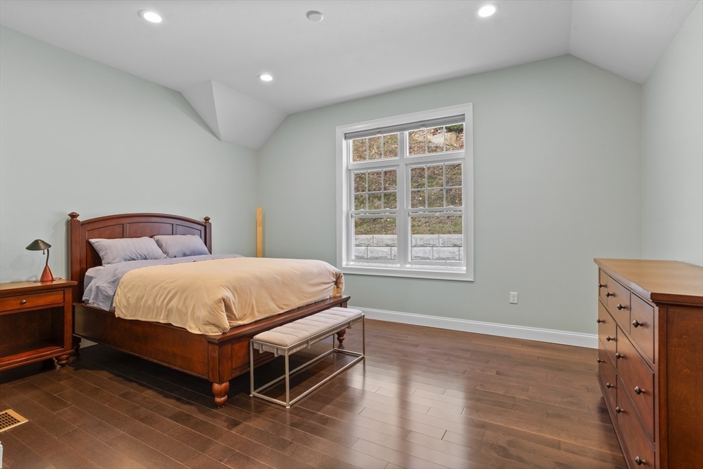 12 Trail Ridge Way, Unit A Harvard, MA 01451 - Photo 17 of 31 a bed sitting in a bedroom next to a window