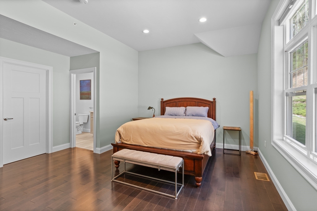 12 Trail Ridge Way, Unit A Harvard, MA 01451 - Photo 18 of 31 a bedroom with a bed and wooden floor