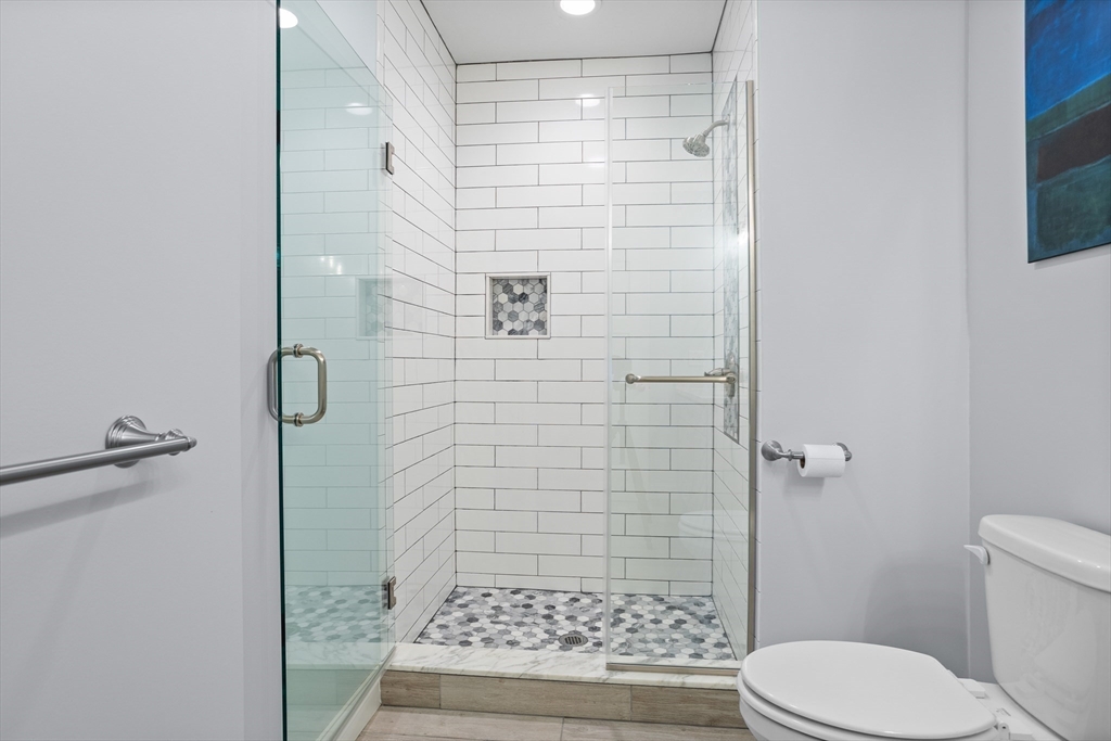 12 Trail Ridge Way, Unit A Harvard, MA 01451 - Photo 20 of 31 a bathroom with a toilet and a shower
