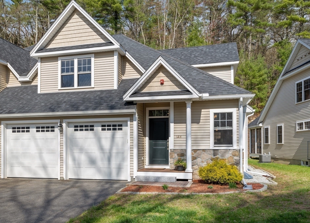 12 Trail Ridge Way, Unit A Harvard, MA 01451 - Photo 2 of 31 a front view of a house with a yard