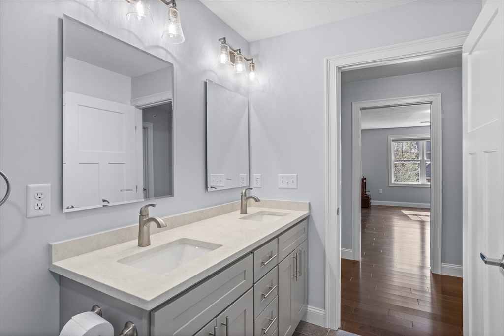 12 Trail Ridge Way, Unit A Harvard, MA 01451 - Photo 26 of 31 a bathroom with a sink and a mirror