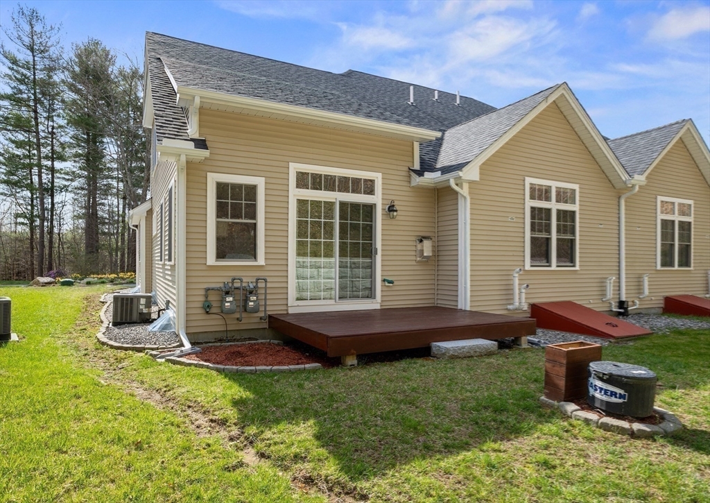 12 Trail Ridge Way, Unit A Harvard, MA 01451 - Photo 28 of 31 a front view of house with yard and outdoor seating
