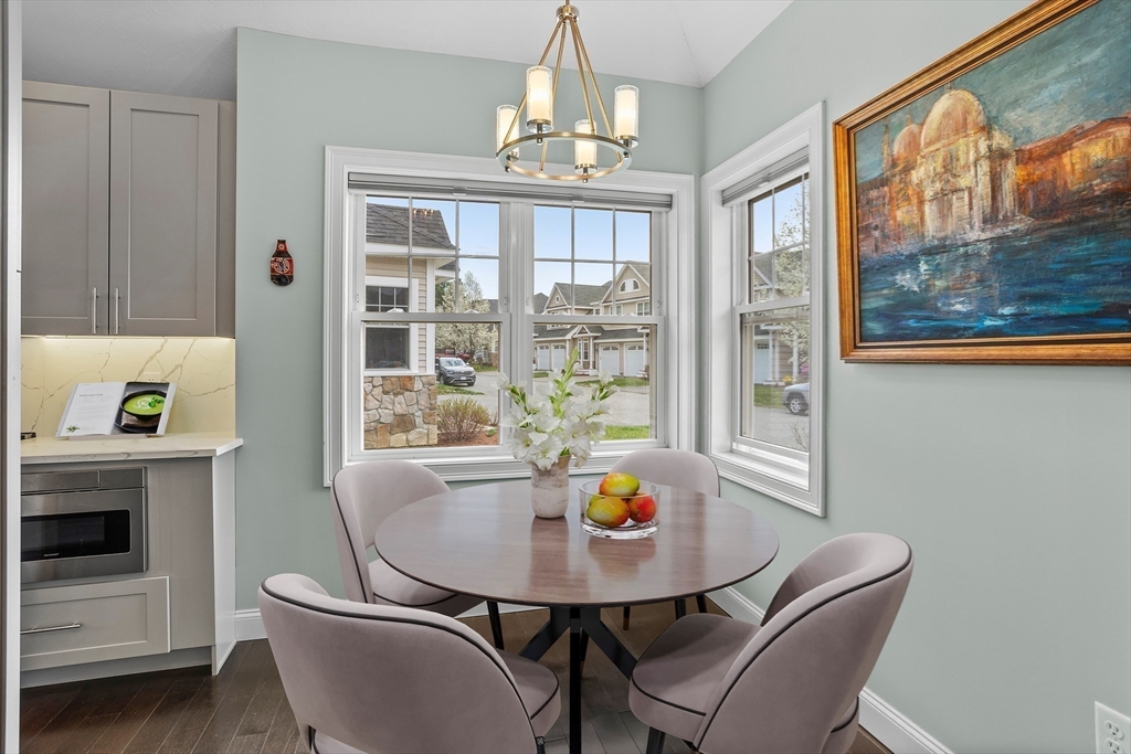 12 Trail Ridge Way, Unit A Harvard, MA 01451 - Photo 8 of 31 a view of a dining room with furniture window and outside view