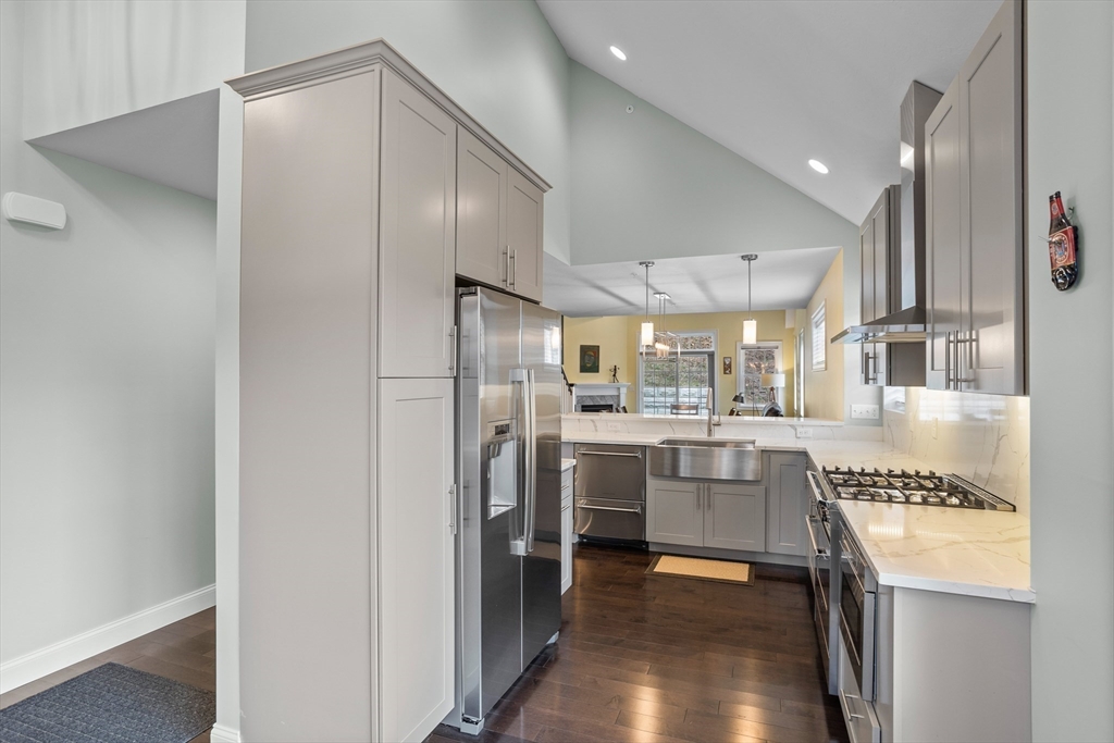 12 Trail Ridge Way, Unit A Harvard, MA 01451 - Photo 10 of 31 a kitchen with stainless steel appliances a refrigerator and a sink