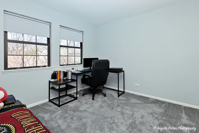 a work room with furniture and windows