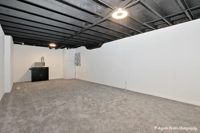 a view of empty room with wooden walls