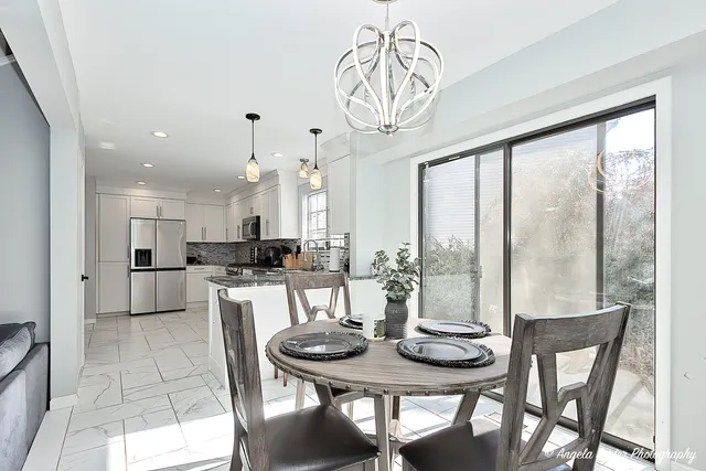 a view of a dining room with furniture window and outside view