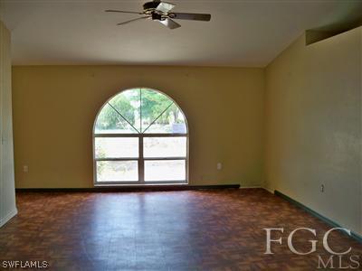 7224 Coolidge Road Fort Myers, FL 33967 - Photo 2 of 10 an empty room with a window