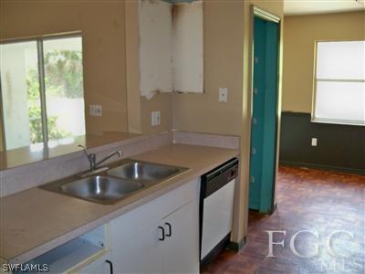 7224 Coolidge Road Fort Myers, FL 33967 - Photo 4 of 10 a kitchen with a sink and cabinets