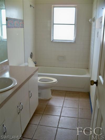 7224 Coolidge Road Fort Myers, FL 33967 - Photo 9 of 10 a bathroom with a sink a toilet and bathtub