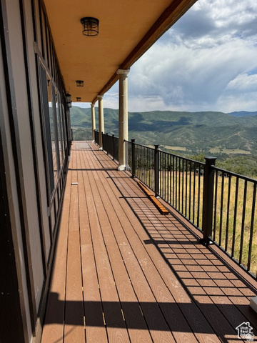 6909 East Spring Drive, Unit 19 Springville, UT 84663 - Photo 67 of 118 Expansive outdoor deck featuring wood-finish flooring and a black metal railing