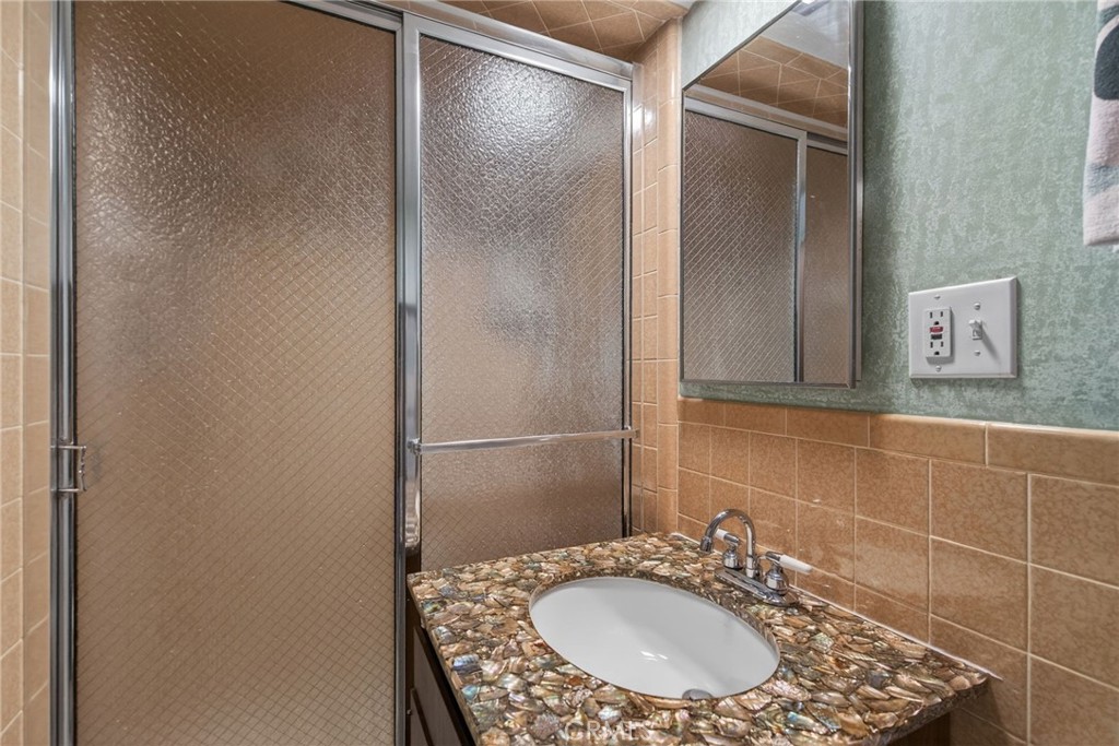 11517 Tulane Avenue Riverside, CA 92507 - Photo 35 of 75 Full bath dowstairs with private closet and storage