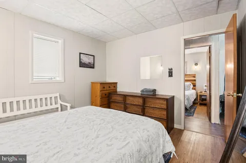 a bedroom with a bed and a table