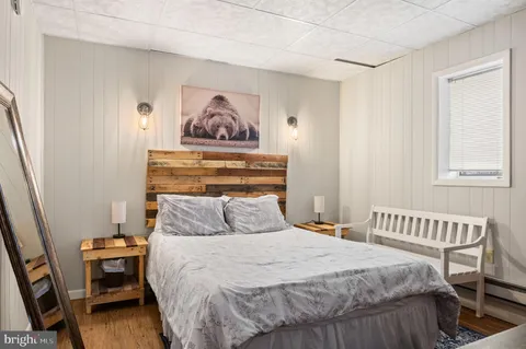 a bedroom with a bed and a table