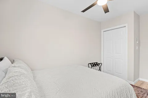 a bedroom with a bed and a lamp